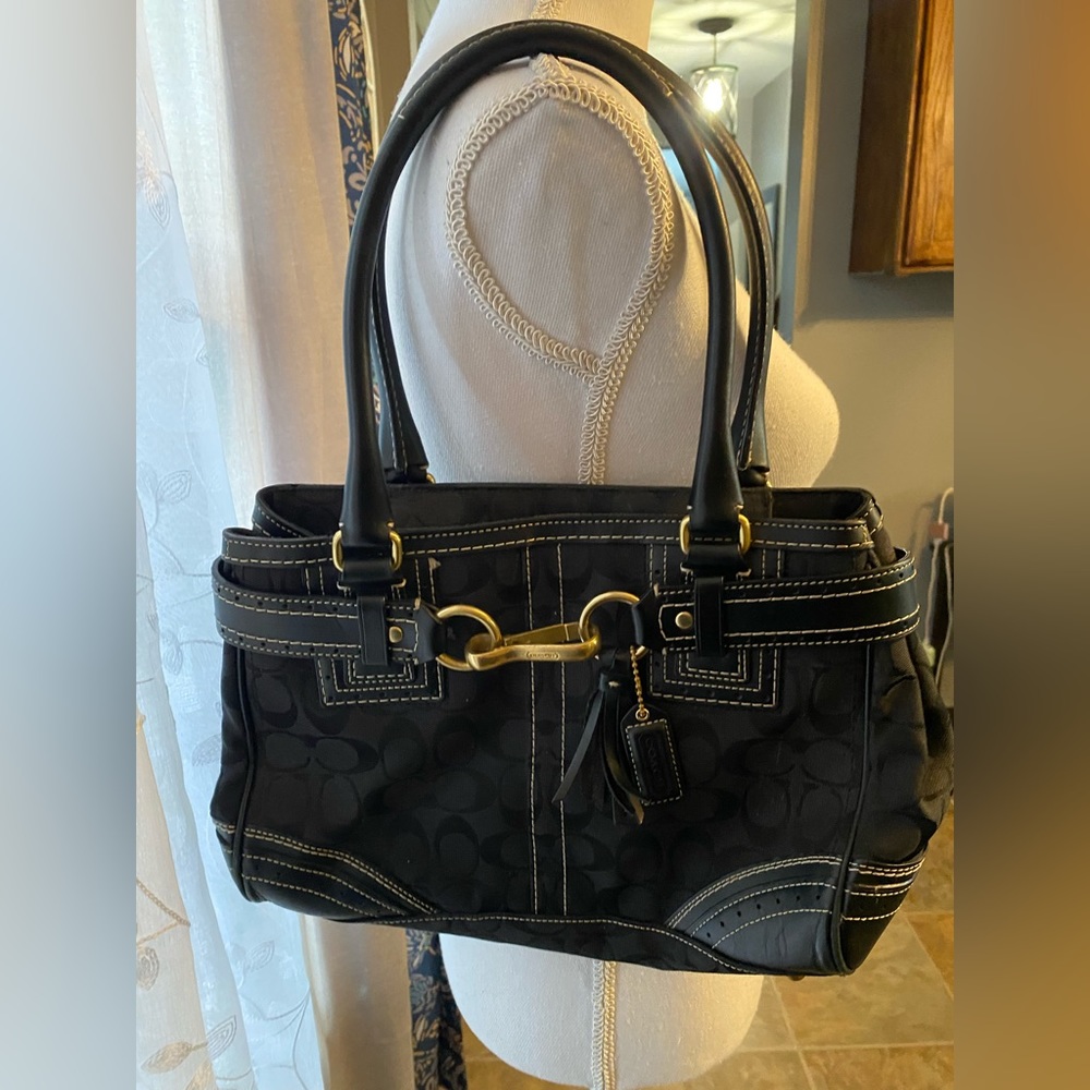 COACH bag gold brass and tassel accents